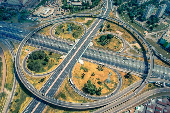 aerial view of green trees and road during daytime