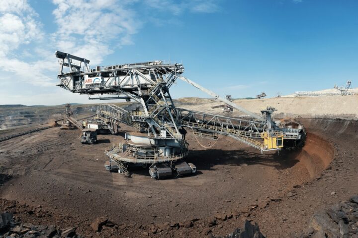white and black airplane on brown sand during daytime