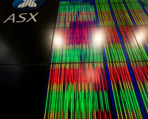 a tall building with a sign that says asx on it