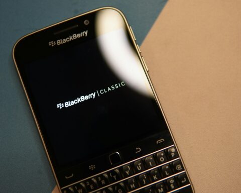black and silver blackberry qwerty phone