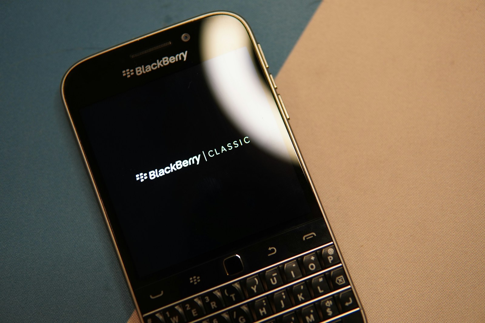 black and silver blackberry qwerty phone